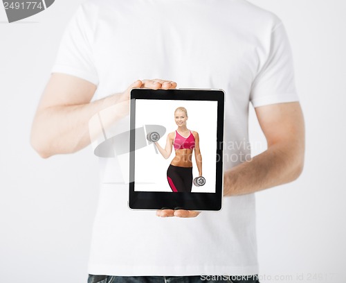 Image of man with tablet pc and sporty woman