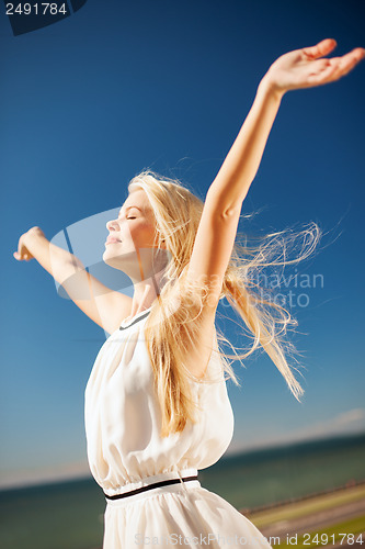 Image of beautiful woman enjoying summer outdoors