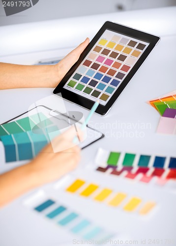 Image of woman working with color samples for selection