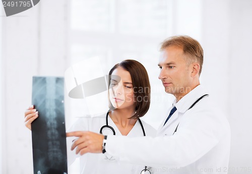 Image of two doctors looking at x-ray