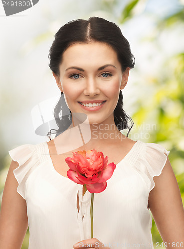 Image of young woman with flower