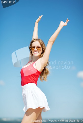 Image of girl standing on the beach