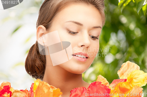 Image of young woman with bouquet of flowers