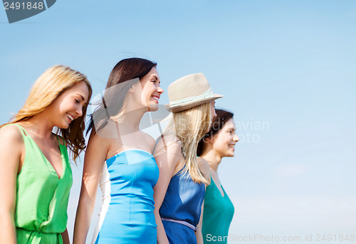 Image of girls walking on the beach