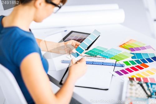 Image of woman working with color samples for selection