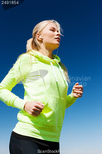 Image of woman doing running outdoors