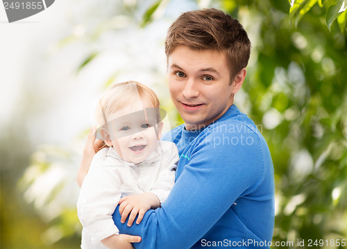 Image of happy father with adorable child