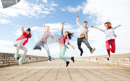 Image of group of teenagers jumping