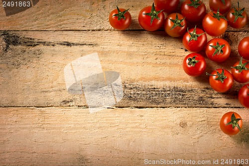 Image of cherry tomatoes on wood background