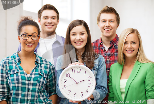 Image of group of students at school with clock