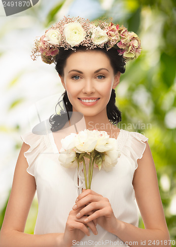 Image of young woman with flower