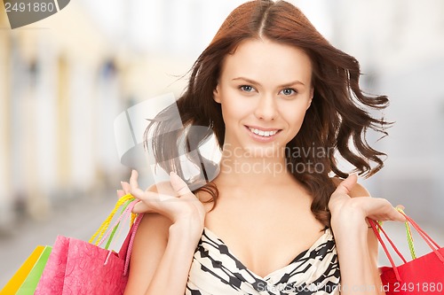 Image of woman with shopping bags in ctiy