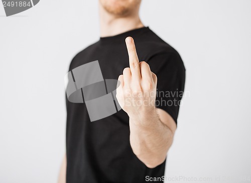 Image of man showing middle finger