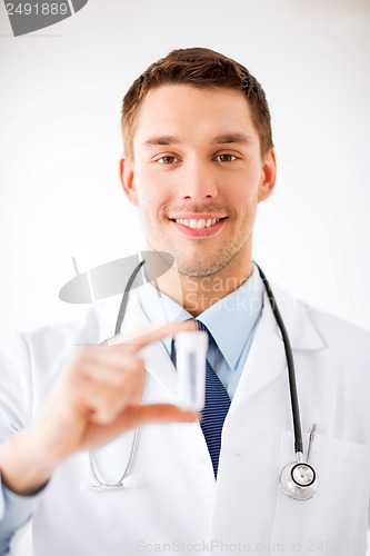 Image of young male doctor with empty test-tube