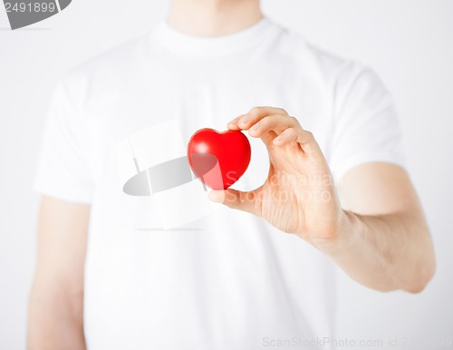 Image of man hands with heart