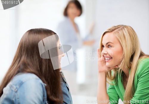 Image of student girls gossiping at school
