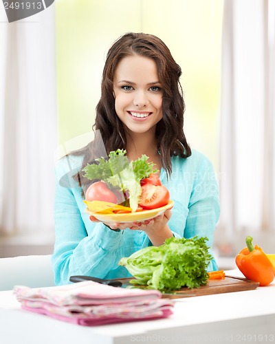 Image of woman in the kitchen with vegetables