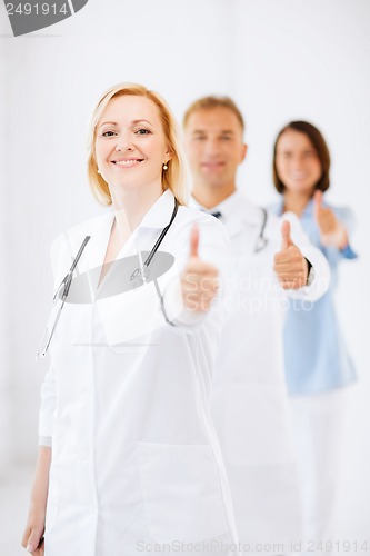 Image of team of doctors showing thumbs up