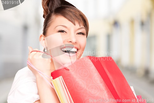 Image of woman with shopping bags in ctiy