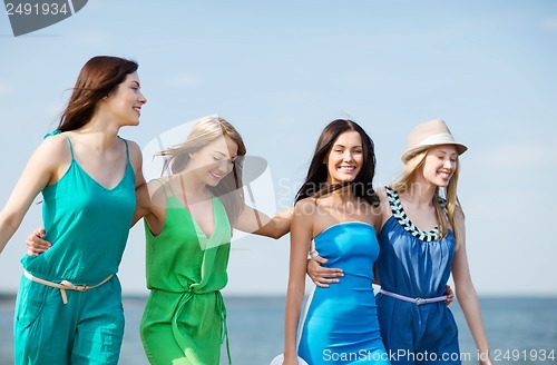 Image of girls walking on the beach