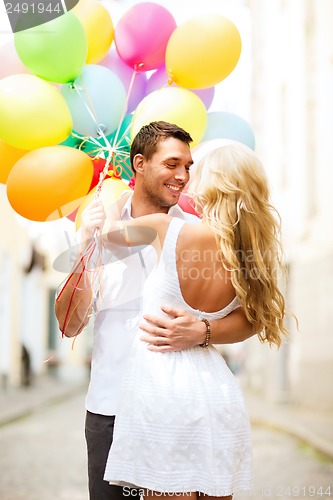 Image of couple with colorful balloons