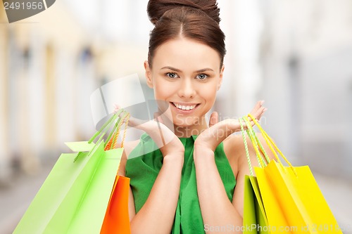 Image of woman with shopping bags in ctiy