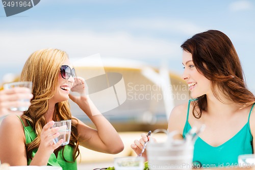 Image of girls in cafe on the beach