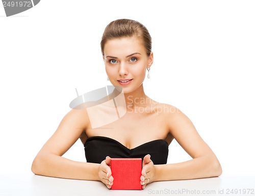 Image of woman with diamond earrings and gift box