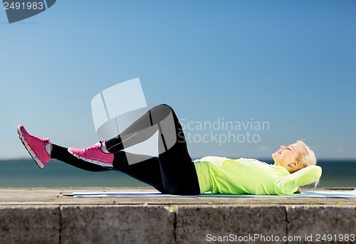 Image of woman doing sports outdoors