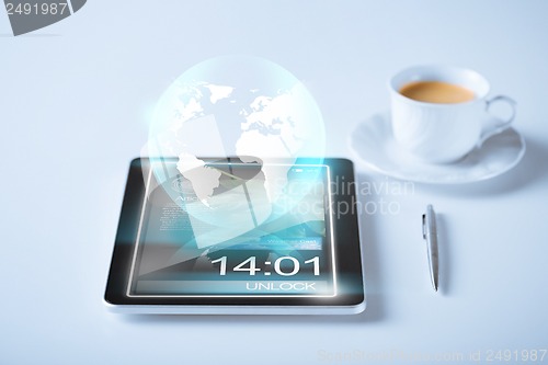 Image of tablet pc with sign of globe