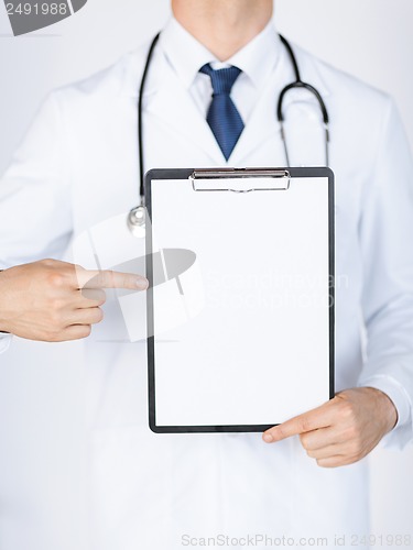 Image of doctor pointing at blank white paper