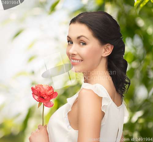 Image of young woman with flower