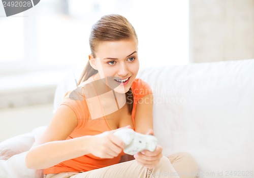 Image of woman with joystick playing video games