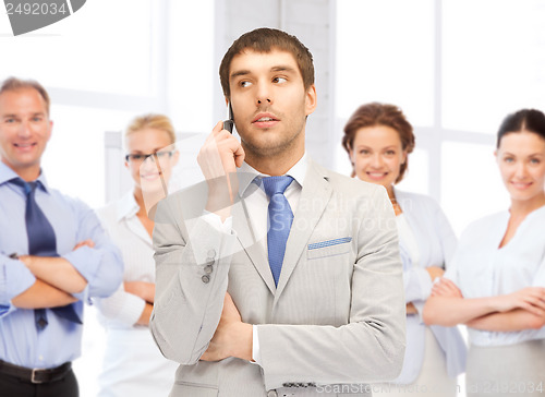 Image of businessman talking on the phone in office