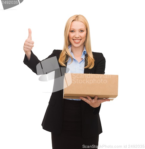 Image of businesswoman holding cardboard box