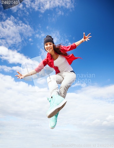 Image of beautiful dancing girl jumping