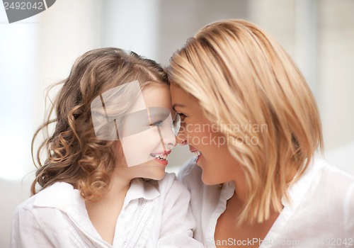 Image of mother and daughter cuddling