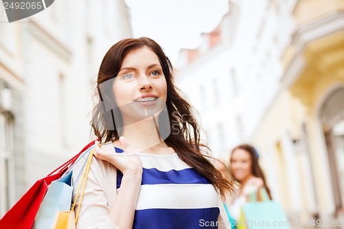 Image of woman with shopping bags in ctiy