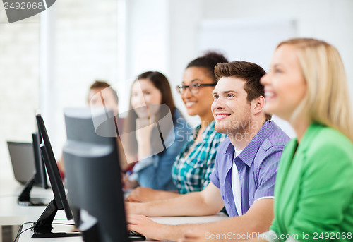 Image of students with computers studying at school