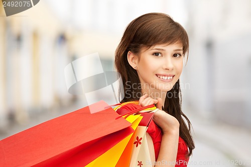 Image of woman with shopping bags in ctiy