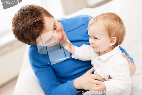 Image of happy father with adorable baby