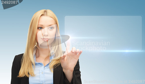 Image of businesswoman touching virtual screen