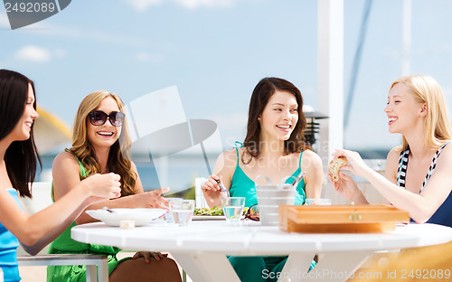 Image of girls in cafe on the beach