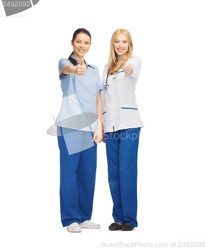 Image of two doctors showing thumbs up