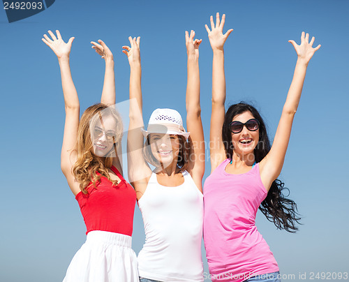 Image of group of girls chilling on the beach