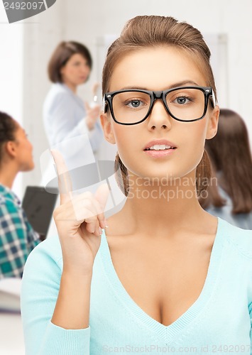 Image of student girl showing warning gesture