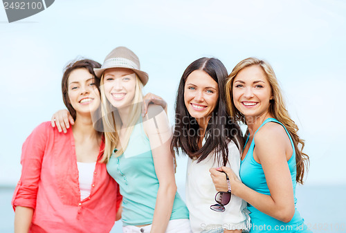 Image of group of girls chilling on the beach