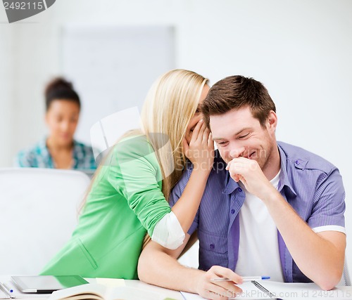 Image of group of students gossiping at school