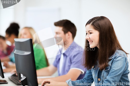 Image of students with computers studying at school