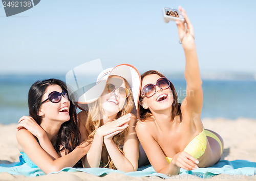 Image of girls taking self photo on the beach
